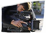 Camera operator filming on location